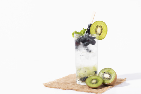 Kiwi cocktails beverage with ripe blueberry on white background. summer drink.の写真素材