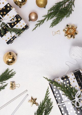 Christmas composition background with decorations and gift box on white background. winter, new year concept. Flat lay, top view, copy space.の写真素材