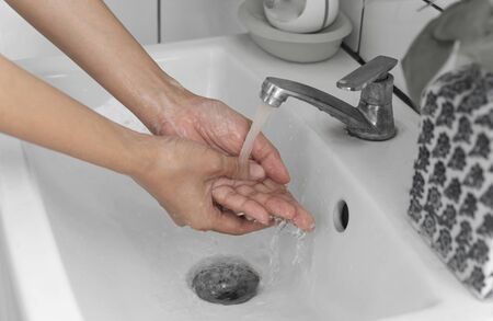 Man Washing hands rubbing with soap for corona virus prevention.