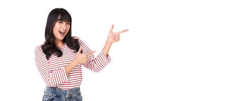 Young beautiful smiling asian girl hand pointing up to copy space isolated on white background.