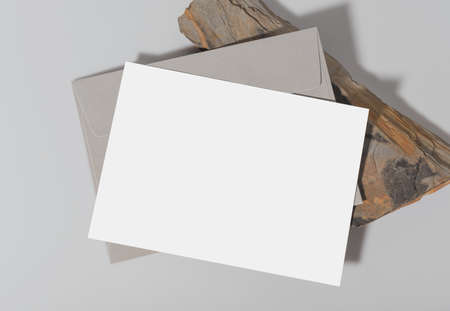Mockup white greeting card with envelope and flower. for mock-up design template.の写真素材