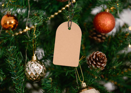 mockup christmas greeting tags on christmas tree background.の写真素材