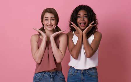 Happy loving lesbian couple good time together isolated on pink background. LGBT concept.の写真素材