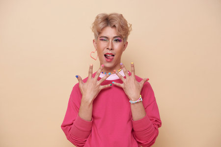 happy smiling youth asian transgender LGBT isolated on nude color background. People lgbt lifestyle...