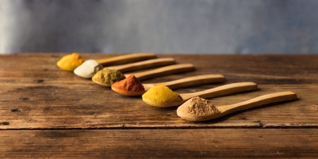 Nutmeg, curry, paprika, cumin, white pepper and turmericの写真素材