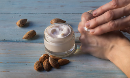 Hand cream of almonds in a glass jar. Homemade almond creamの写真素材
