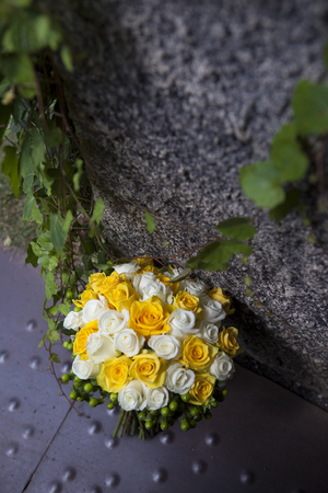 Bouquet of flowers hanged in the wallの写真素材