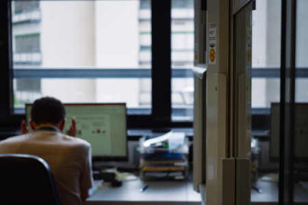 Angry doctorate student working with data in the computer while being stressed and exhaustedの写真素材