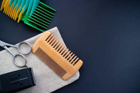 Flat Lay of barber tools, scissors, comb, electric razor and heads on dark background. Copy spaceの写真素材
