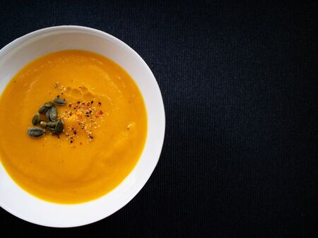 Vegan soup with autumn ingredients such a pumpkin and carrotsの写真素材