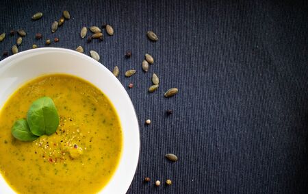 Top view of a white plate with spinach cream.の写真素材