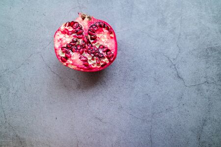 Isolated pomegranate on concrete background.の写真素材
