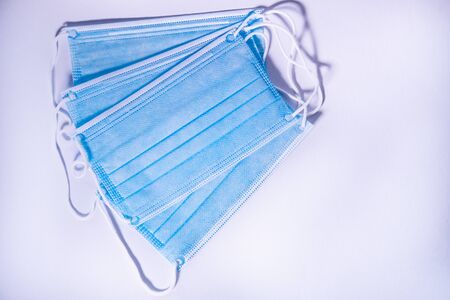 Protective face masks for coronavirus isolated on white background. Covid-19. Top view.