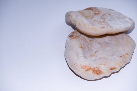 Pita bread isolated on white background. Arabic cuisine. Close up view.の写真素材
