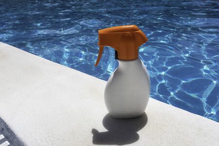 Sunscreen on the pool on a sunny summer day