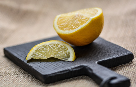 Lemon on the cutting boardの写真素材
