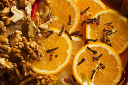 Christmas time! Fresh orange slices, cloves and walnuts.の写真素材