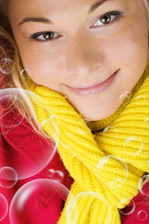 Smiling lady wearing winter scarf - and bubblesの写真素材