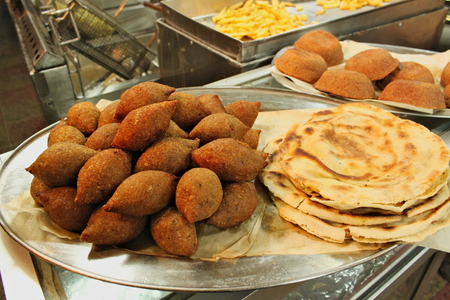Traditional kebbe and pita bread on a plate in lebanese restaurantの写真素材