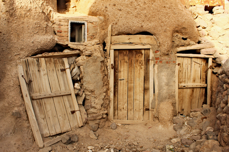 Entrance door to buildings in rock in Kandovan town in Iran.の写真素材