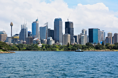 Australia; Sydney October 25th 2018 -View on business centre with skyscrappers. View from bay with turquoise water.のeditorial素材