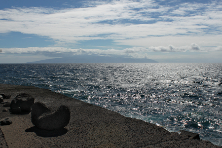 View on The Atlantic Ocean with La Gomera Island at the background. View from Los Gigantes site on Tenerife Islandの写真素材