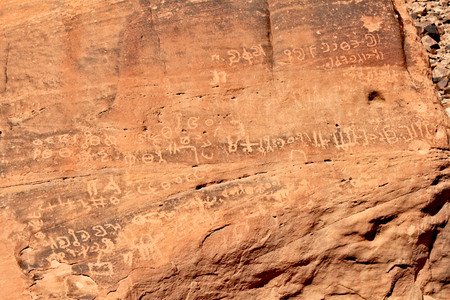 Ancient text on the Wadi Rum rocks in Jordanの写真素材