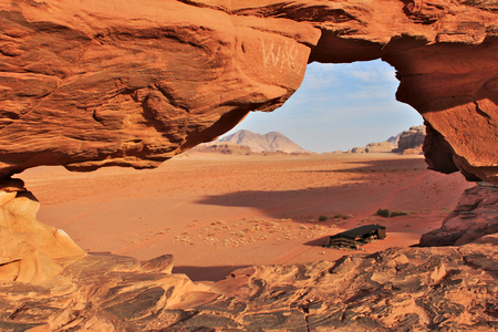 Wadi Rum red dessert in Jordan. Nomad`s tent seen through window in big natural rock.の写真素材