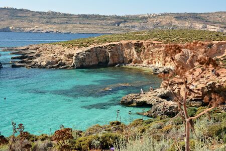 Blue Lagoon, Malta / June 3rd 2019 - Comino Island, with turquoise clear waters and rocky backgroundの写真素材