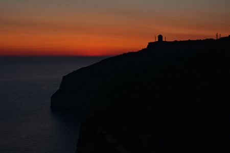 Sunsent at the Dingli Cliffs on Malta. Rocky terrain with Mediterraean Sea on the horizon.の写真素材