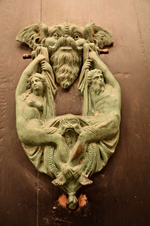 Malta, Rabat, June 4th 2019 - Decorative knocker to a wooden door at the old town of Mdina in Maltaのeditorial素材