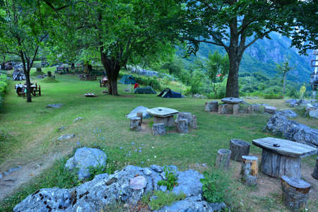 Teth - tourist camping in Albanian village in mountains. Green grass and trees in high mountains.の写真素材