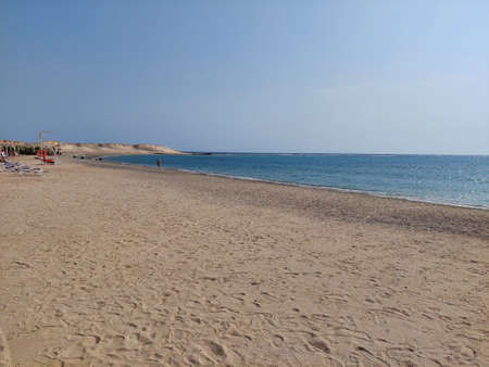 Beautiful bay in Marsa Alam, Egypt. Sandy beach and crystal clear sea. Walking along the beach.の写真素材