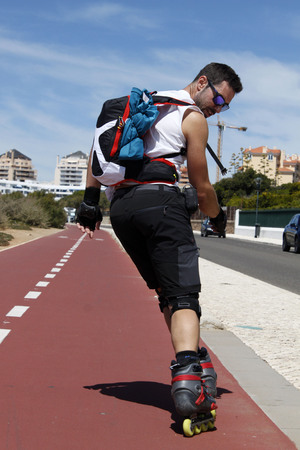 Guy skating backwards on vacationの写真素材
