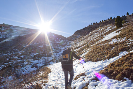 hiker in the snow in a sunny dayの写真素材