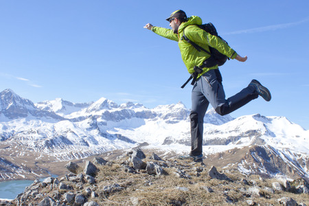 hiker feeling exited and powerful in the high of the mountainの写真素材