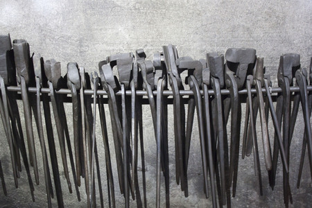 grey tools pending from a wireの写真素材