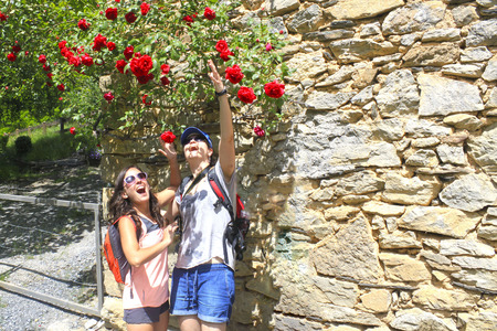 two women enthusiastic with some flowers in spring