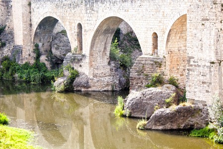 bridge and a chair over a river and its reflection, Spainの写真素材