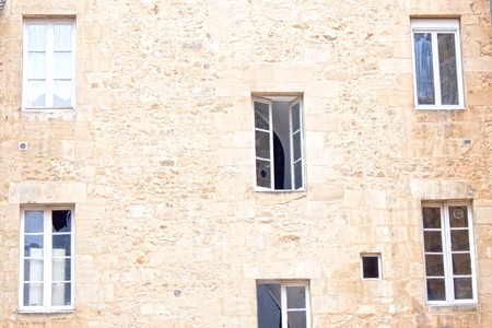 Six windows in a wall, some of them openの写真素材