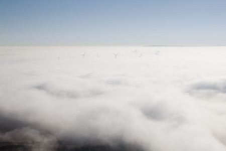 background of the mist and some mills in front of us