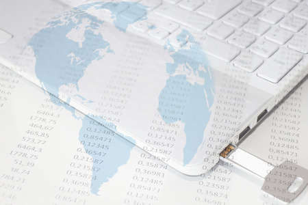computer with a pendrive, numbers and a world globe