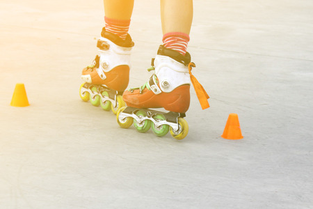 girl turning while skating with cones
