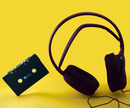 headphones and a cassette in a yellow backgroundの写真素材