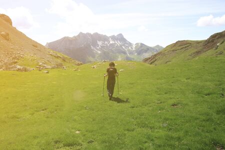 People hiking up the mountain covered of snowの写真素材