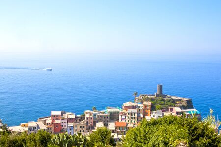 Monterosso a village from the cinque terre with its houses and the sea with a boatの写真素材