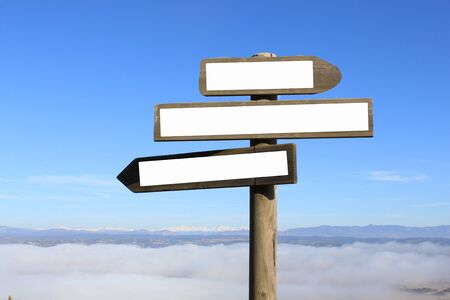 three signs indicating the way to anywhereの写真素材