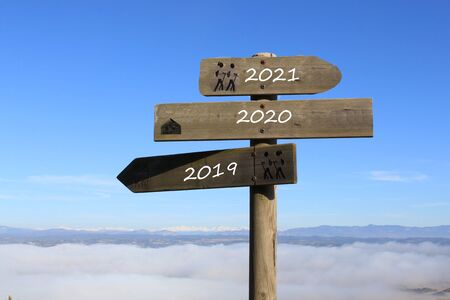 three signs indicating the way to 2019, 2021 or 2020 yearの写真素材