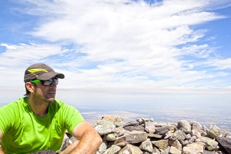 Man with a cap over a hill with stones in Spainの写真素材