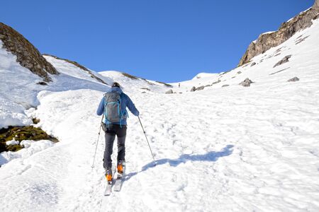 man making touring ski in Pyrenees mountains in Franceの写真素材